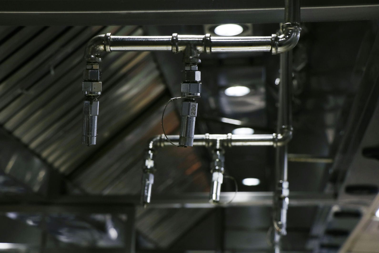 A fire suppression unit installed in a restaurant kitchen