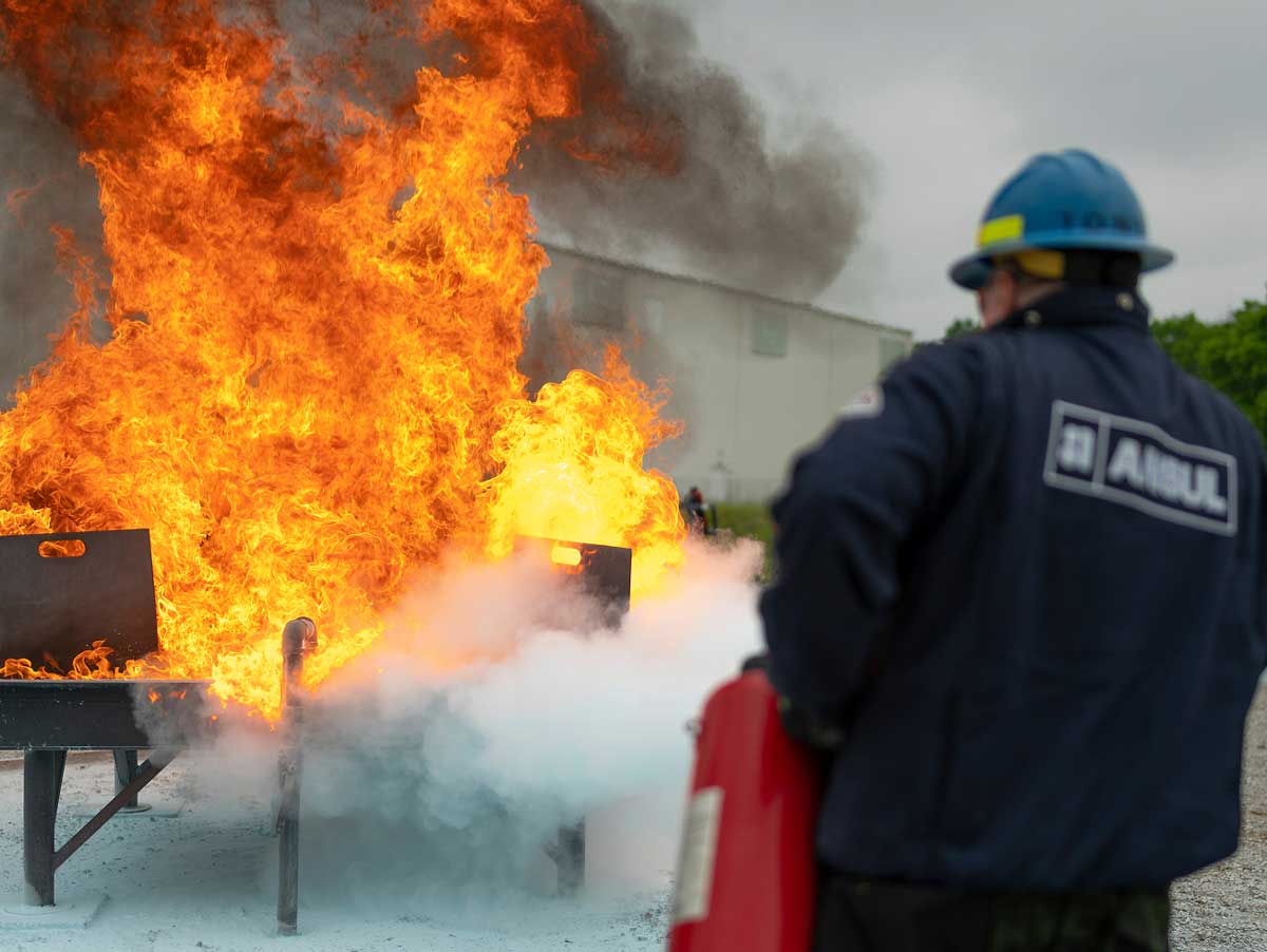 ANSUL-employee-extinguishing-a-fire