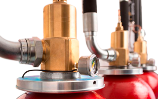 Close-up of the tops of a row of fire extinguishers